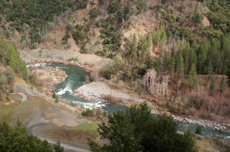 [The river is a reversed S shape here in the valley with several white-water rapids visible. The light-colored rock contrasts with the green-blue water.]